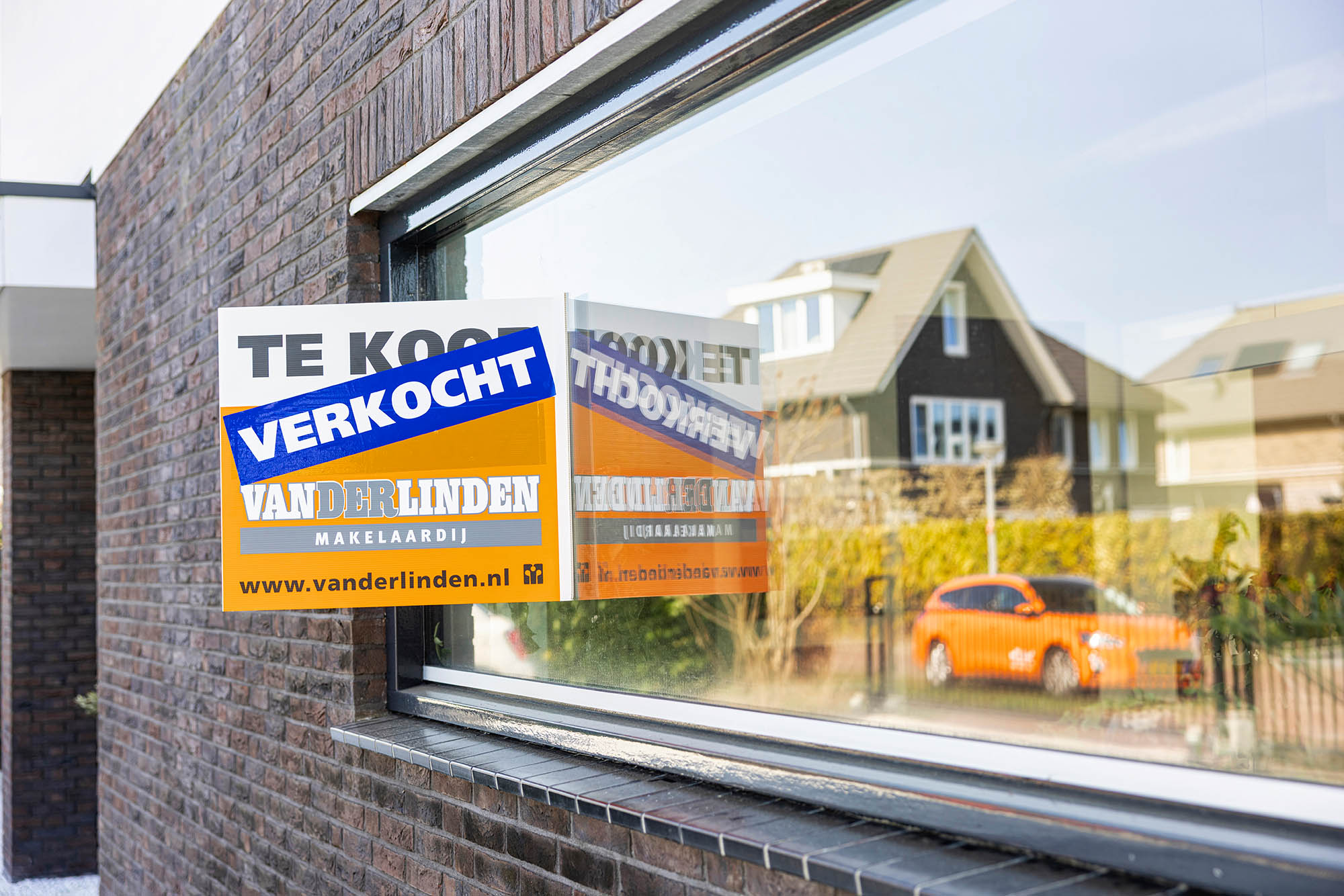 Sold sign on house